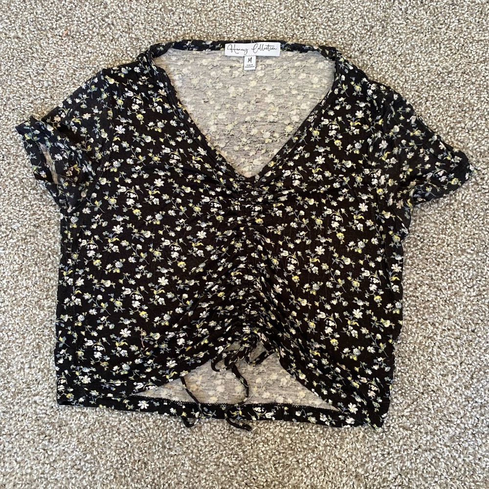 Floral crop top with a cinched middle and tie bottom